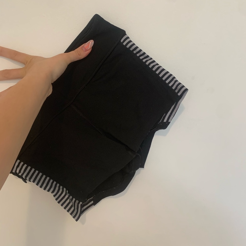 Black shorts with black and white stripped sides